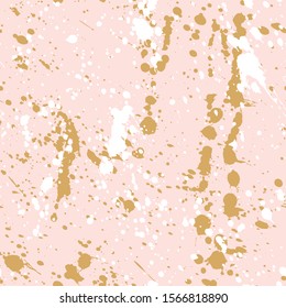 Gold paint splatters texture on the pink background, seamless pattern