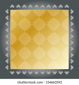 gold painted frame on a grey background