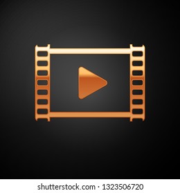 Gold Play Video icon isolated on black background. Film strip with play sign. Vector Illustration