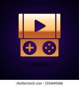 Gold Portable video game console icon isolated on dark blue background. Gamepad sign. Gaming concept.  Vector Illustration
