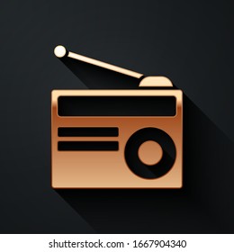 Gold Radio with antenna icon isolated on black background. Long shadow style. Vector Illustration