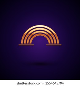 Gold Rainbow with clouds icon isolated on dark blue background.  Vector Illustration