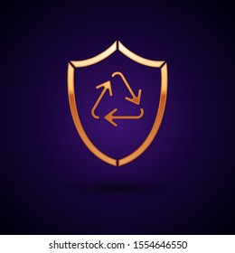 Gold Recycle symbol inside shield icon isolated on dark blue background. Eco protection sign.  Vector Illustration