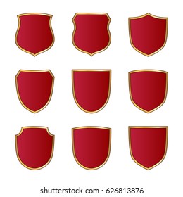 Gold and red shield shape icons set. Logo emblem metallic signs isolated on white background. Shape shield symbol of security, protection or armor, safe. Shiny element design Vector illustration