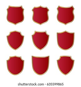 Gold and red shield shape icons set. Logo emblem metallic signs isolated on white background. Shape shield symbol of security, protection or armor, safe. Shiny element design Vector illustration