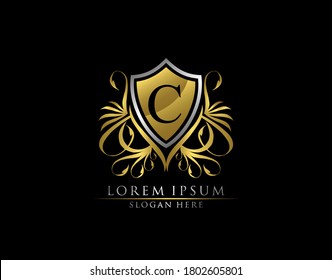 Gold Royal Shield C Letter Logo. Graceful Elegant gold shield icon design.  