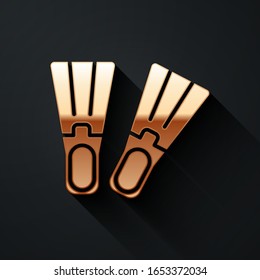 Gold Rubber flippers for swimming icon isolated on black background. Diving equipment. Extreme sport. Sport equipment. Long shadow style. Vector Illustration