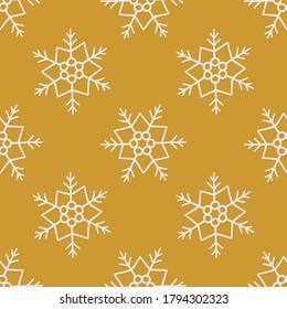 Gold seamless pattern with cute snowflakes. Hand drawn snow texture. Vector illustration in doodle style