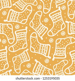 Gold Seamless pattern winter new year background. Vector Doodle white hand drawn santa socks with polka dot.