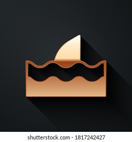 Gold Shark fin in ocean wave icon isolated on black background. Long shadow style. Vector