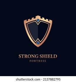 gold shield logo. illustration of the shield with a strong fortress