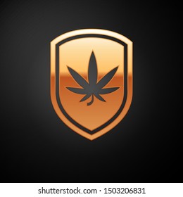 Gold Shield and marijuana or cannabis leaf icon isolated on black background. Marijuana legalization. Hemp symbol.  Vector Illustration