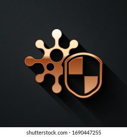 Gold Shield protecting from virus, germs and bacteria icon isolated on black background. Immune system concept. Corona virus 2019-nCoV. Long shadow style. Vector Illustration