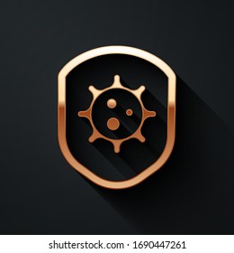 Gold Shield protecting from virus, germs and bacteria icon isolated on black background. Immune system concept. Corona virus 2019-nCoV. Long shadow style. Vector Illustration