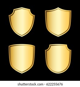 Gold shield shape icons set. 3D golden emblem signs isolated on black background. Symbol of security, power, protection. Badge shape shield design Vector illustration
