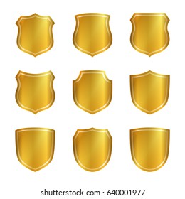 Gold shield shape icons set. 3D golden emblem signs isolated on white background. Symbol of security, power, protection. Badge shape shield graphic design Vector illustration