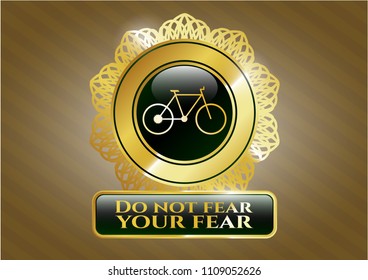   Gold shiny badge with bike icon and Do not fear your fear text inside