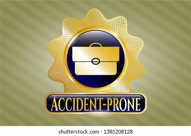  Gold shiny badge with briefcase icon and Accident-prone text inside