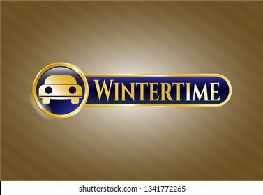  Gold shiny badge with car seen from front icon and Wintertime text inside