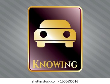  Gold shiny badge with car seen from front icon and Knowing text inside
