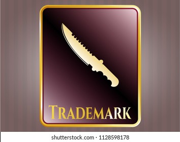  Gold shiny badge with combat knife icon and Trademark text inside
