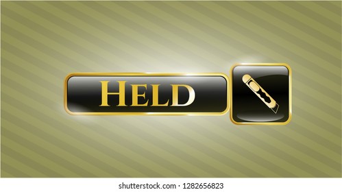  Gold shiny badge with cutter icon and Held text inside