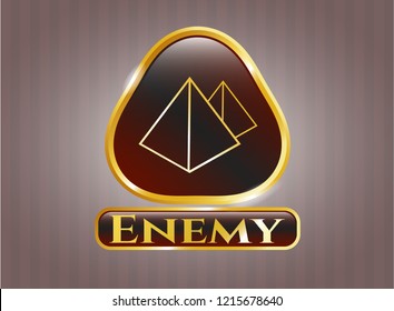  Gold shiny badge with pyramids icon and Enemy text inside