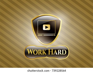  Gold shiny badge with video player icon and Work Hard text inside