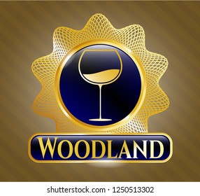  Gold shiny badge with wine cup icon and Woodland text inside