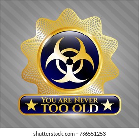  Gold shiny emblem with biohazard icon and You are Never too old text inside