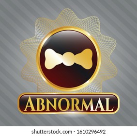  Gold shiny emblem with bow tie icon and Abnormal text inside