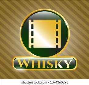   Gold shiny emblem with film icon and Whisky text inside