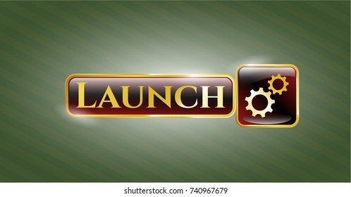  Gold shiny emblem with gear, team work icon and Launch text inside