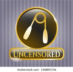  Gold shiny emblem with hand gripper icon and Uncensored text inside