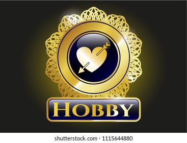                                Gold shiny emblem with heart with arrow icon and Hobby text inside                                           