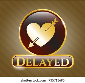  Gold shiny emblem with heart with arrow icon and Delayed text inside
