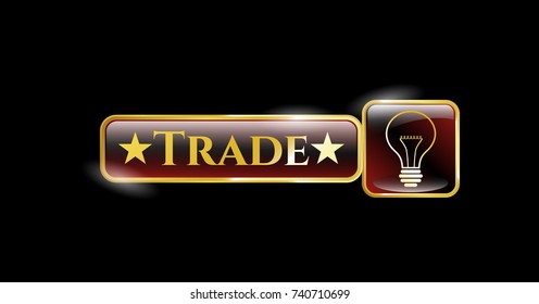  Gold shiny emblem with idea icon and Trade text inside