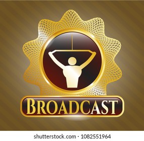   Gold shiny emblem with lat pull down, exercise icon and Broadcast text inside