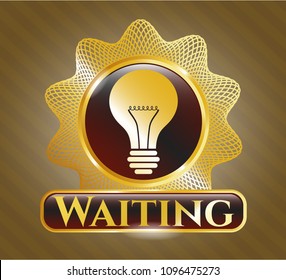   Gold shiny emblem with light bulb icon and Waiting text inside