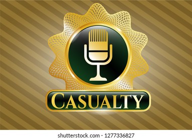  Gold shiny emblem with microphone icon and Casualty text inside