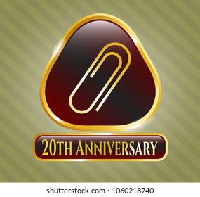 Gold shiny emblem with paper clip icon and 20th Anniversary text inside