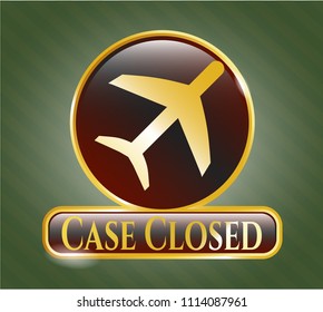   Gold shiny emblem with plane icon and Case Closed text inside