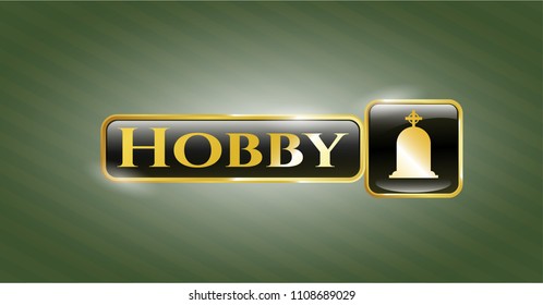   Gold shiny emblem with tombstone icon and Hobby text inside