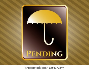  Gold shiny emblem with umbrella icon and Pending text inside