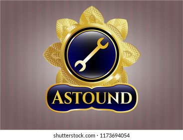  Gold shiny emblem with wrench icon and Astound text inside
