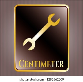  Gold shiny emblem with wrench icon and Centimeter text inside