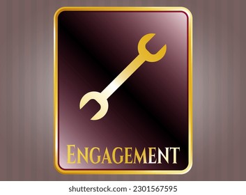 Gold shiny emblem with wrench icon and Engagement text inside