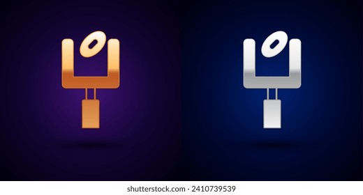 Gold and silver American football goal post and football ball icon isolated on black background.  Vector