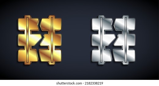 Gold and silver Broken or cracked rails on a railway icon isolated on black background. Long shadow style. Vector