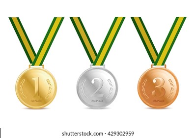 Gold, silver and bronze medals on green ribbons with shiny metallic surfaces. Rio 2016 Summer Games.